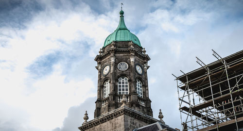 Low angle view of clock tower against sky