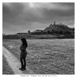 Woman on beach against sky