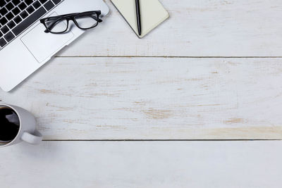 High angle view of coffee cup on table