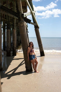 Full length portrait of woman on beach