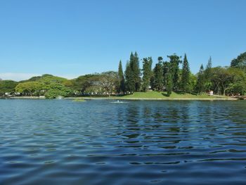 Scenic view of lake against blue sky