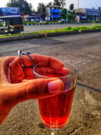 Close-up of hand holding drink