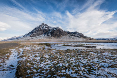 Scenic view of snowcapped mountain against sky