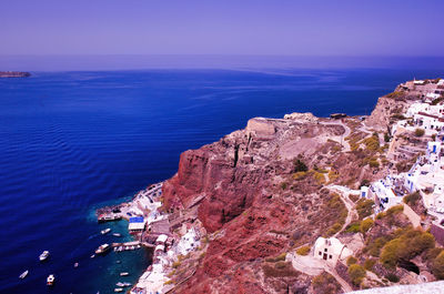 Imerovigli, santorini, greece. view to the clifftop village in daytime. wide angle shot of houses