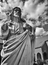 Low angle view of statue against sky