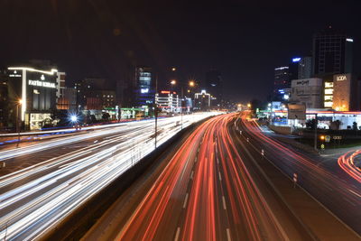 High angle view of light trails on road at night