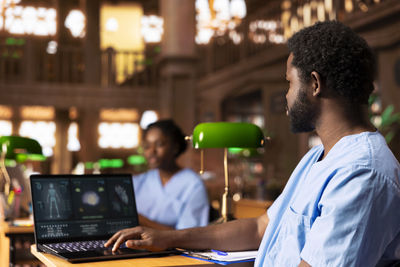 Man using laptop at night
