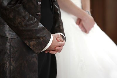 The hands of a bride and a groom
