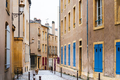 Alley amidst buildings in city