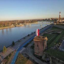 High angle view of bridge over river in city against clear sky