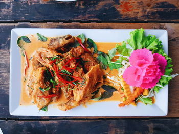 High angle view of flowers in plate on table