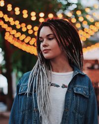 Portrait of a beautiful young woman looking away