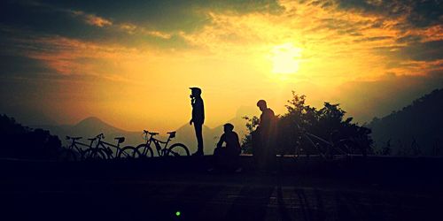 Silhouette of people at sunset