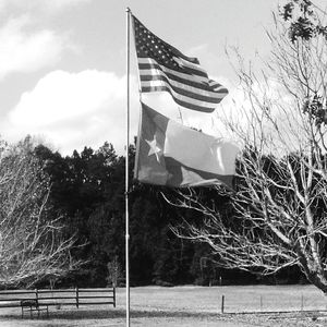 Scenic view of flag against sky