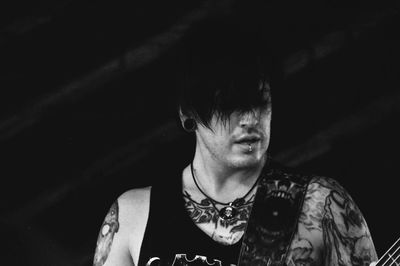 Low angle view of tattooed punk musician