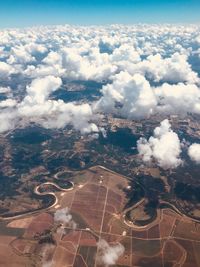 Aerial view of landscape against cloudy sky