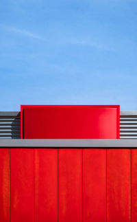 Red building against blue sky