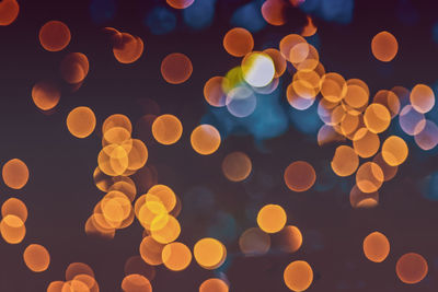 Defocused image of illuminated lights at night