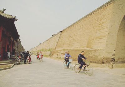 People riding bicycle in city