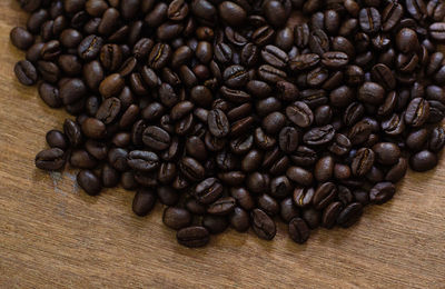 Close-up of coffee beans on table