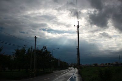 View of road against cloudy sky