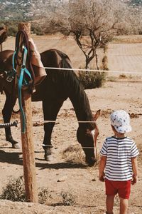 Little kid with a horse