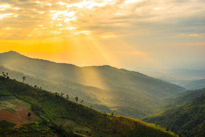 Scenic view of mountains against sky during sunset