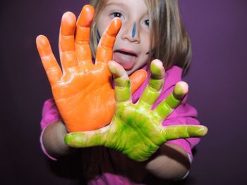 Close-up of woman hand against black background