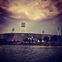 Built structures against cloudy sky