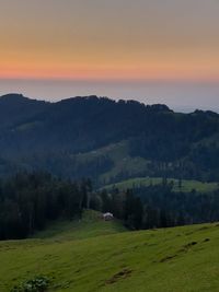 Scenic view of landscape against sky during sunset