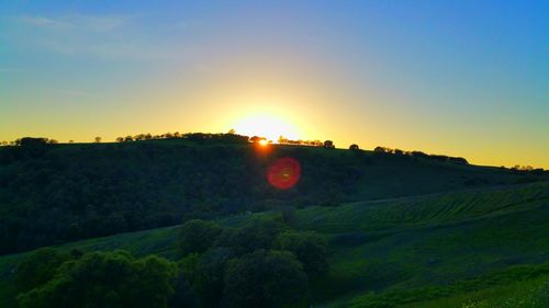 Scenic view of landscape at sunset
