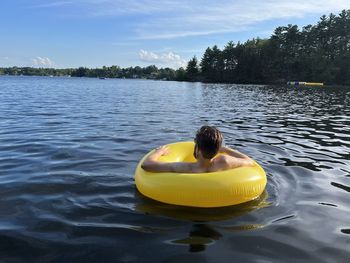 Rear view of man in lake