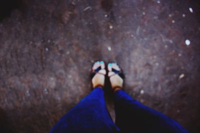 Low section of woman standing on floor