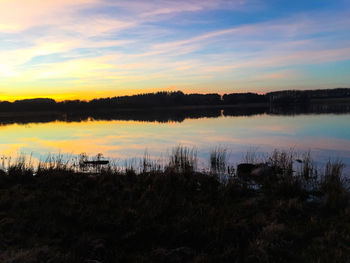 Reflection of clouds in calm lake