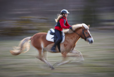 Girl riding horse