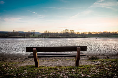 Scenic view of river against sky at sunset