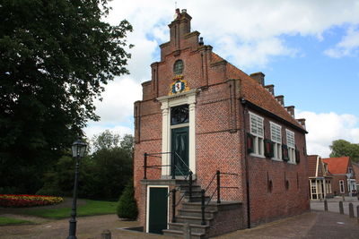 Historic brick building with step-roof, town hall in spanbroek, the netherlands