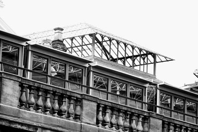 Low angle view of train on bridge against sky