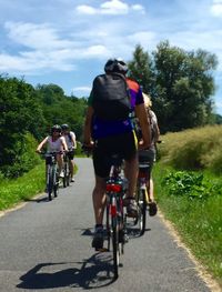 People riding bicycle on road