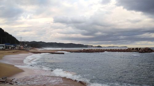 Scenic view of beach against sky