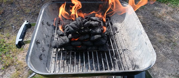 High angle view of meat on barbecue grill