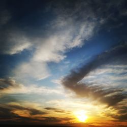 Low angle view of dramatic sky during sunset