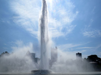 Water splashing against sky