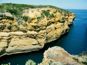 High angle view of rocks on sea shore