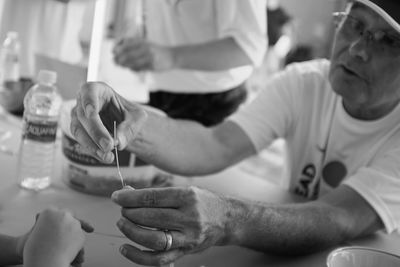 Close-up of man holding hands