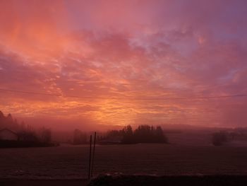 Scenic view of silhouette landscape against sky during sunset