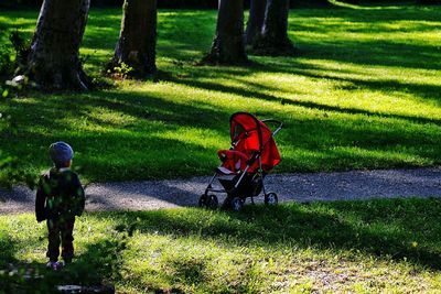 Man walking on grassy field in park