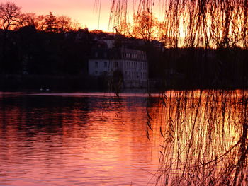 Scenic view of lake at sunset