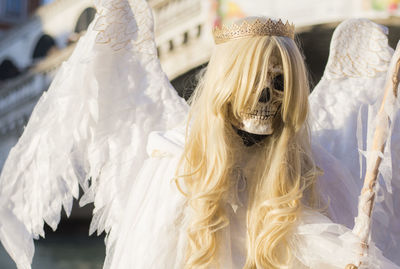 Close-up of skeleton in angel costume
