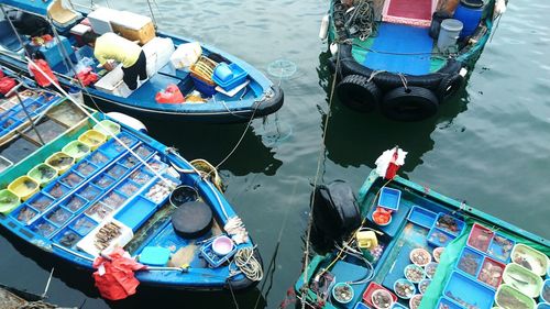 High angle view of boats moored in water